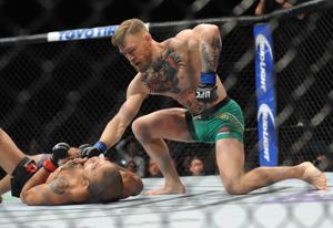 December 12, 2015; Las Vegas, NV, USA; Conor McGregor moves in to land punches and win via technical knockout against Jose Aldo during UFC 194 at MGM Grand Garden Arena.