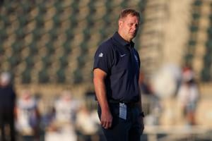 Oct 11, 2025; Honolulu, Hawaii, USA;  Utah State Aggies head coach Bronco Mendenhall walks the field before his team takes on the Hawaii Rainbow Warriors at Clarence T.C. Ching Athletics Complex. Mandatory Credit: Marco Garcia-Imagn Images