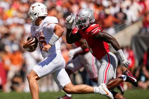 Ohio State Buckeyes linebacker Arvell Reese (8) pursues Texas Longhorns quarterback Arch Manning (16) during the NCAA football game at Ohio Stadium on Aug. 30, 2025.