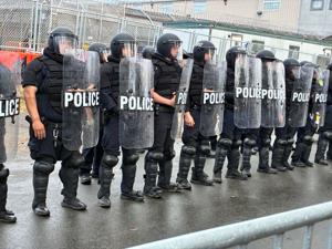 A line of police in riot gear stood outside Delaney Hall detention center in Newark observing pro- and anti-ICE protesters Saturday, May 30, 2026.