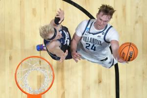 Mar 20, 2026; San Diego, CA, USA; Villanova Wildcats forward Duke Brennan (24) shoots the ball against Utah State Aggies forward Karson Templin (22) during a first round game of the men's 2026 NCAA Tournament at Viejas Arena. Mandatory Credit: Kirby 