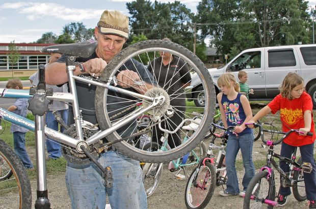 Volunteer crew fixes up bikes for school kids