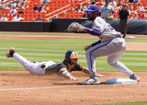 May 13, 2023; Stillwater, OK, USA; Oklahoma State Cowboys second baseman Roc Riggio (7) slides into third base ahead of the throw to Kansas State Wildcats infielder Kaelen Culpepper (22). Mandatory Credit: Brett Rojo-USA TODAY Sports