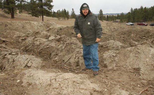 Richard White Clay examines an archaeological site