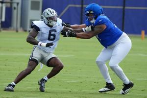 Aug 11, 2026; Woodland Hills, CA, USA; Dallas Cowboys linebacker Donovan Ezeiruaku (6) and Los Angeles Rams offensive tackle Alaric Jackson (77) during a joint practice at the Rams Practice Facility. Mandatory Credit: Kirby Lee-Imagn Images