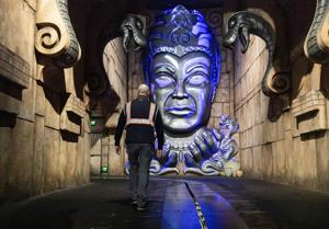 Nicholas DiBernardo, who helped lead the recent refurbishment of Indiana Jones Adventure, walks toward Mara, the deity within the Temple of the Forbidden Eye.