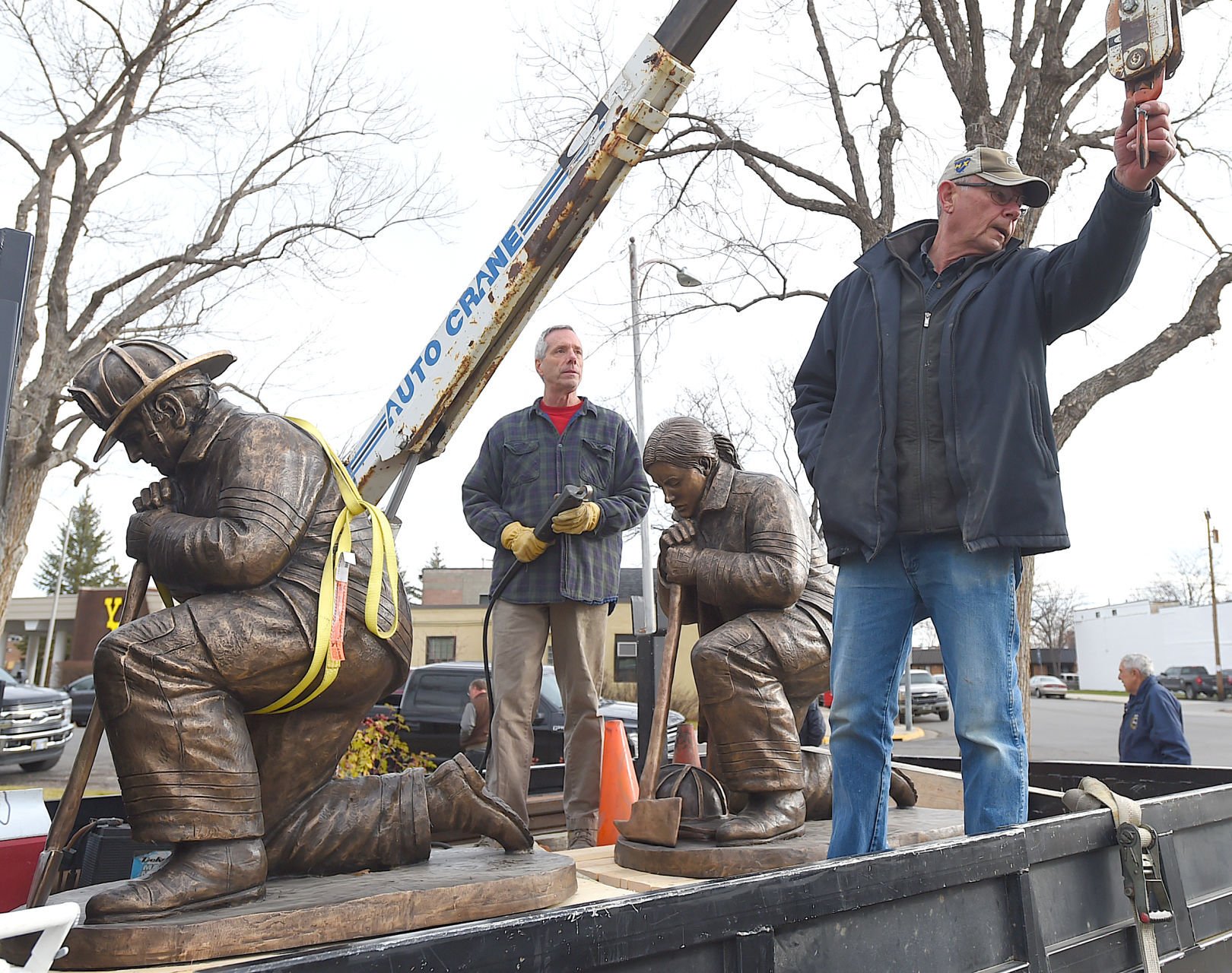 Photos Bronze statues installed at Firefighter Memorial