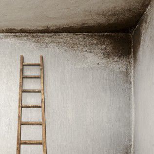 stucco-wall-with-wooden-ladder-83850794.jpg