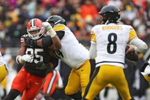 Cleveland Browns defensive end Myles Garrett (95) tries to get past Pittsburgh Steelers guard Spencer Anderson (74) as quarterback Aaron Rodgers (8) looks to throw during the second half of an NFL football game at Huntington Bank Field, Dec. 28, 2025