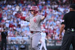 Jun 22, 2026; Omaha, NE, USA;  Oklahoma Sooners shortstop Jaxon Willits (7)  signals to the bench after driving in a run against the North Carolina Tar Heels during the fourth inning at Charles Schwab Field. Mandatory Credit: Steven Branscombe-Imagn 