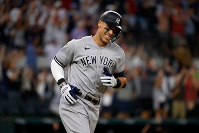 Aaron Judge of the New York Yankees smiles as he rounds the bases after hitting his American-League record 62nd home run of the season, against the Texas Rangers at Globe Life Field on October 4, 2022, in Arlington, Texas.