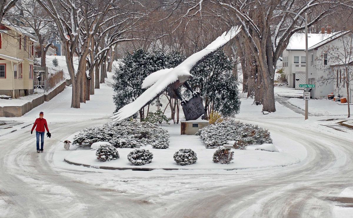 Snow, cold, gusty winds push through North Dakota Bismarck