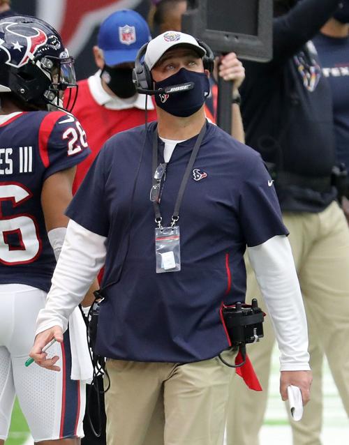 Houston Texans head coach Bill O'Brien checks the scoreboard during action against the Minnesota Vikings at NRG Stadium in Houston on October 4, 2020.