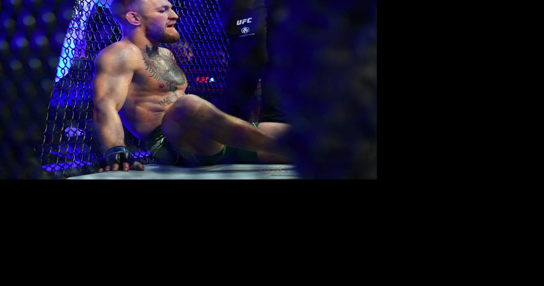 Conor McGregor reacts following an injury suffered against Dustin Poirier during UFC 264 at T-Mobile Arena.