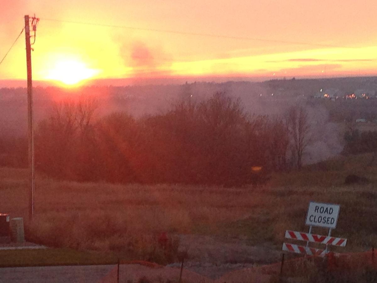 Fire near River Road in NW Bismarck at sunset