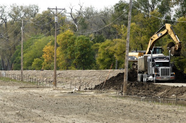 Contractor sues Burleigh County over dike removal bids