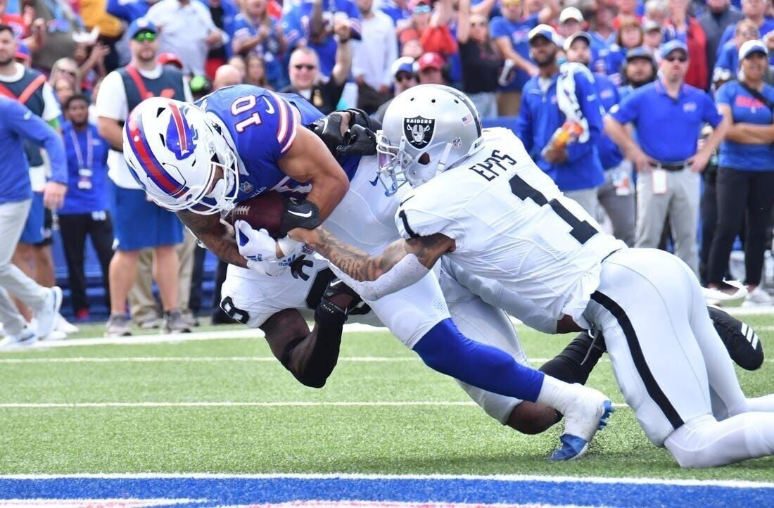 Las Vegas Raiders wide receiver Davante Adams (17) runs for a touchdown  during the first half of an NFL football game against the Buffalo Bills,  Sunday, Sept. 17, 2023, in Orchard Park