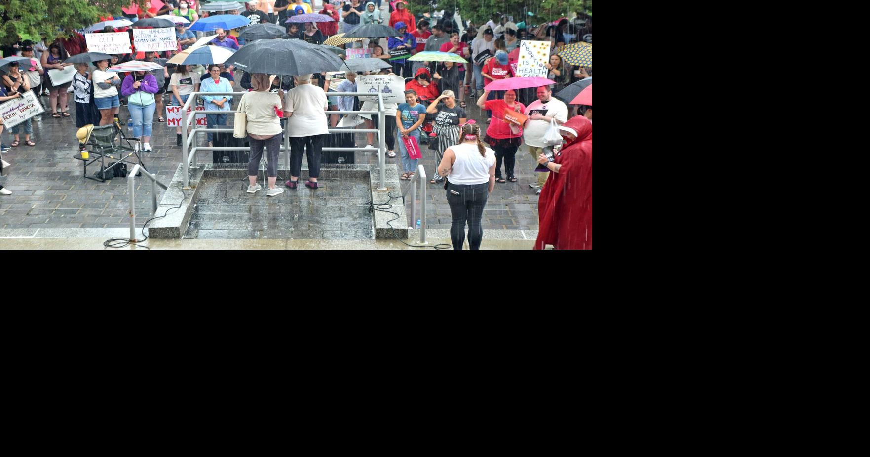Abortion rights rally at Capitol draws crowd despite downpour