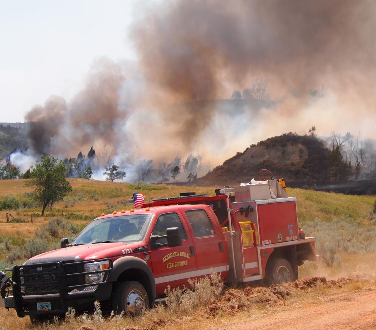 Volunteer firefighters battle blaze in rough terrain North Dakota