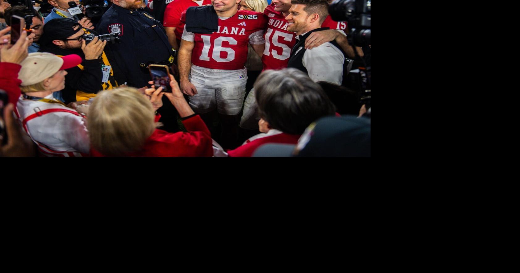 Indiana's Fernando Mendoza (15) and Alberto Mendoza (16) pose with family as they celebrates after the College Football Playoff National Championship college football game at Hard Rock Stadium in Miami Gardens on Monday, Jan. 19, 2026.