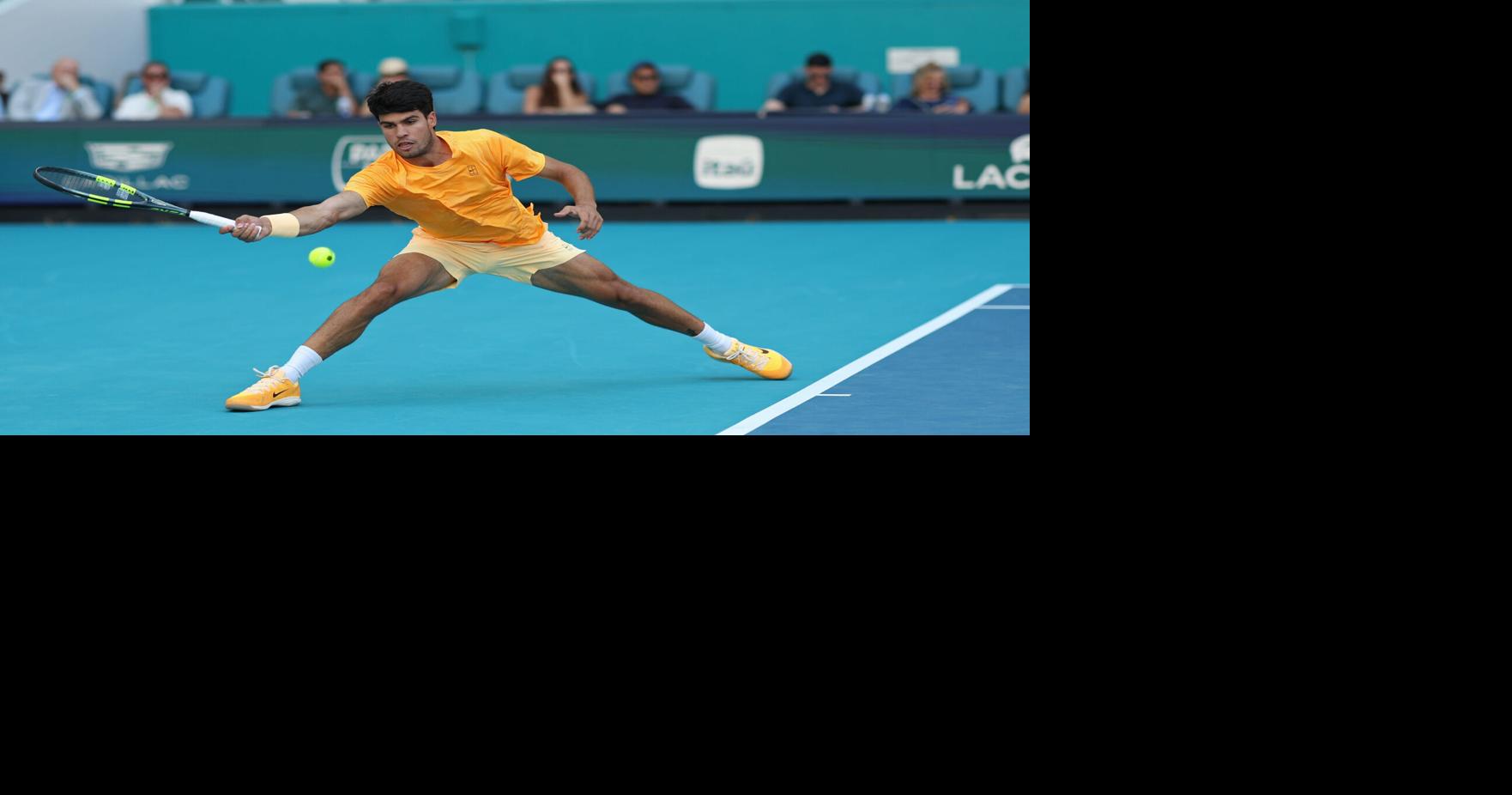 Carlos Alcaraz reaches for a forehand at the 2026 Miami Open.