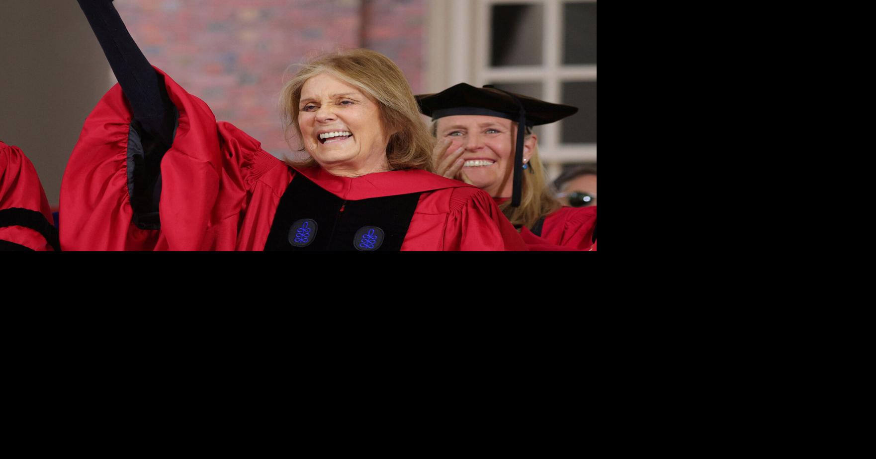 FILE PHOTO: Gloria Steinem salutes the graduating students as she receives and honorary Doctor of Humane Letters during Harvard University's 371st Commencement Exercises