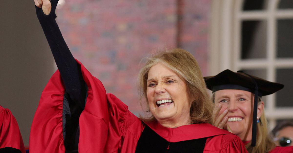 FILE PHOTO: Gloria Steinem salutes the graduating students as she receives and honorary Doctor of Humane Letters during Harvard University's 371st Commencement Exercises