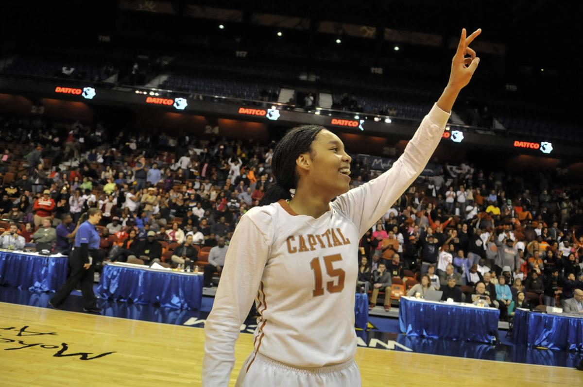 Kiah Gillespie of Capital Prep celebrates her team's Class L championship after defeating Weaver 69-53 in March of 2014.