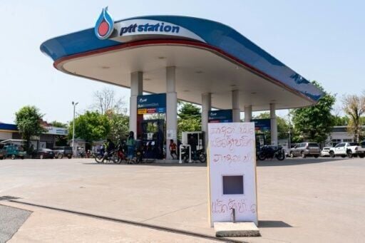 'Diesel run out and gasoline run out' reads a sign at a gas station in Vientiane in Laos on March 10, 2026