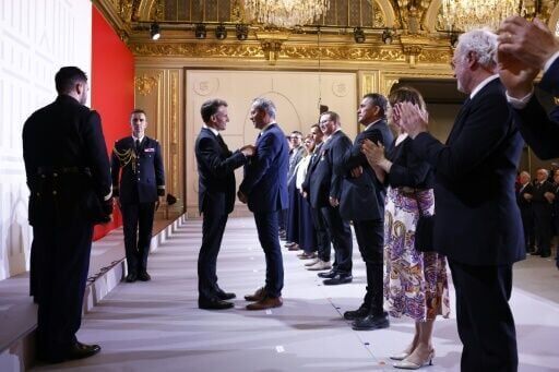 France's Macron honours craftspeople who rebuilt Notre Dame