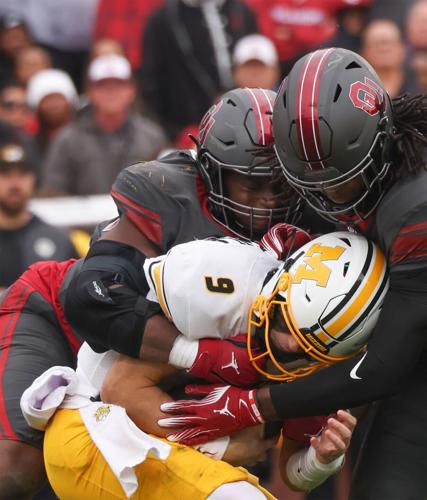 Mizzou quarterback Beau Pribula (9) is tackled by Oklahoma defensive