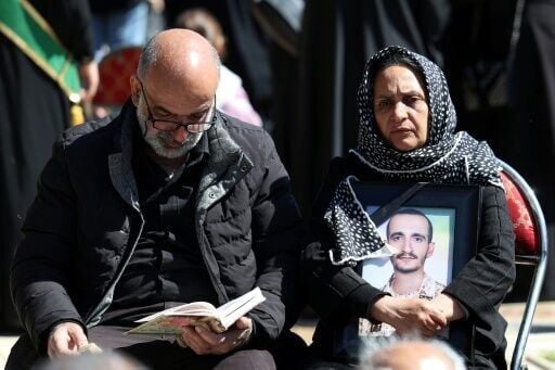 Mourners at a funeral for victims of the Middle East war, in Tehran