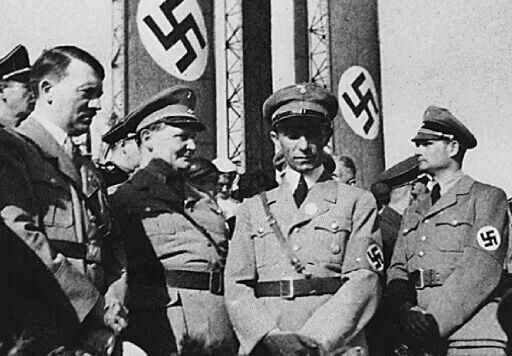 The photographer who took the pictures was working for Nazi propaganda chief Joseph Goebbels (centre)