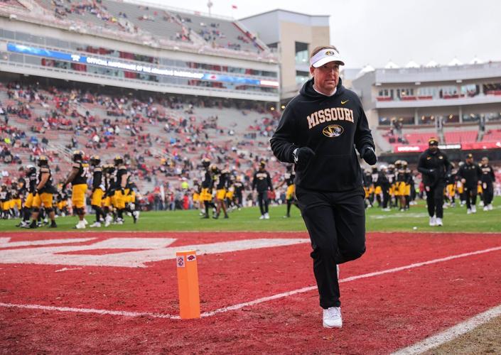Mizzou head coach Eli Drinkwitz runs off the field