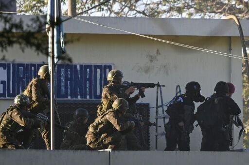 Soldiers take position outside the maximum-security prison in Escuintla, Guatemala