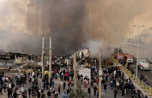 Firefighters battle the blaze at Jannat Bazaar, west of Tehran