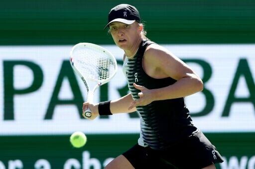 Two-time champion Iga Swiatek is through to the third round at Indian Wells after a straight-sets victory ver US qualifier Kayla Day