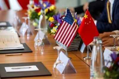 Stocks muted as investors track US-China trade talks