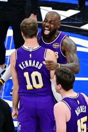 LeBron James celebrates with Luke Kennard after the Los Angeles Lakers thrilling victory over the Orlando Magic