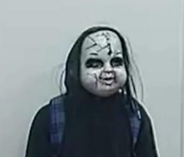 Watch moment man in Chucky mask chases woman