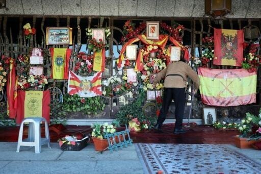 A person sweeping in front of Francisco Franco's tomb at the Mingorrubio cemetery on the 50th anniversary of his death
