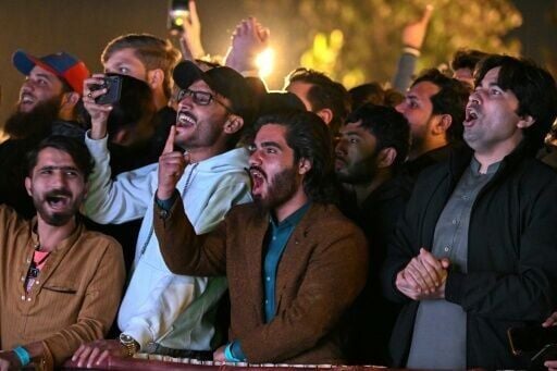 Fans cheer as they watch the T20 Cricket World Cup match between India and Pakistan streaming live from Colombo