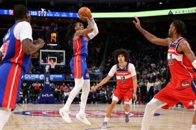 Detroit's Daniss Jenkins sank a three-pointer at the regulation buzzer to force overtime and the Pistons beat Washington to stretch their win streak to seven games