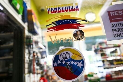 Venezuela-themed stickers decorate a window in the Doral food mart