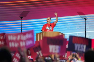 United Auto Workers President Shawn Fain wears a shirt reading 'Trump is a Scab' at the Democratic National Convention on Aug. 19, 2024.