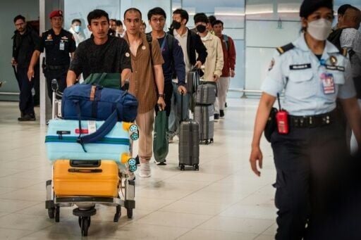 The 20 Thai sailors landed at Thailand's main international airport in Bangkok