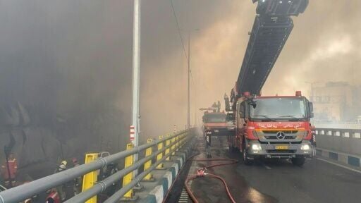 Smoke billows after a massive fire broke out at a bazaar west of the Iranian capital