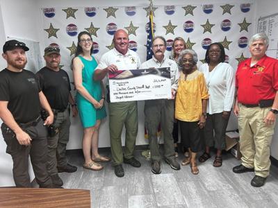 WoodmenLife Selma donates $1,000 to Dallas County Sheriff for Project LifeSaver