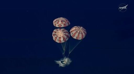 This video grab made from a NASA livestream shows Artemis II astronauts splashing down in the Pacific Ocean off the coast of California