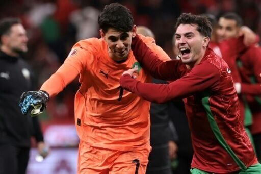 Morocco goalkeeper Yassine Bounou celebrates with Brahim Diaz after the AFCON hosts beat Nigeria on penalties in their semi-final